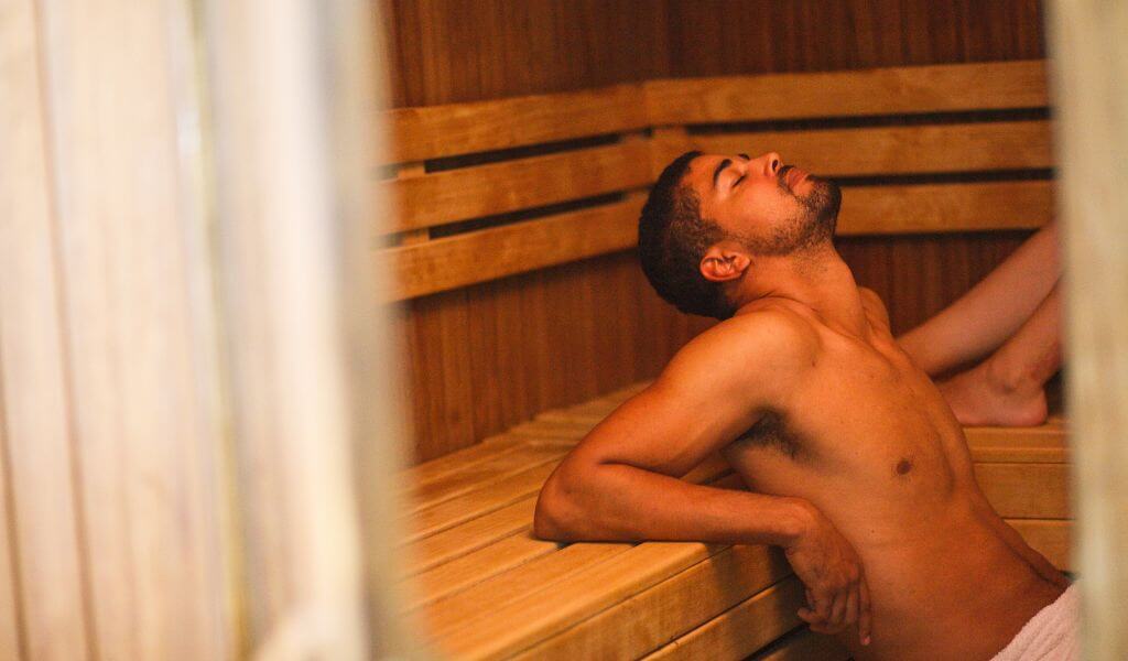Man experiencing sauna therapy for health and wellness
