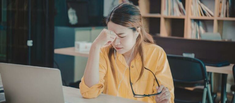 Woman experiencing fatigue due to stress and hormonal imbalance